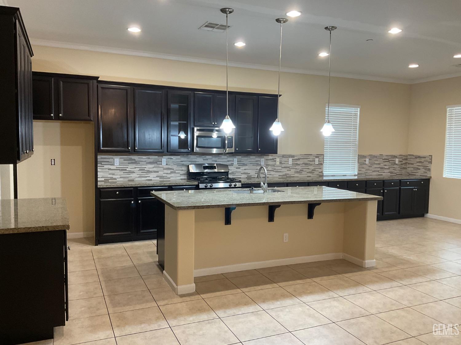 Undisclosed Address Bakersfield, CA 93314 - Photo 4 of 31 a kitchen with stainless steel appliances granite countertop a sink a stove a refrigerator and a oven