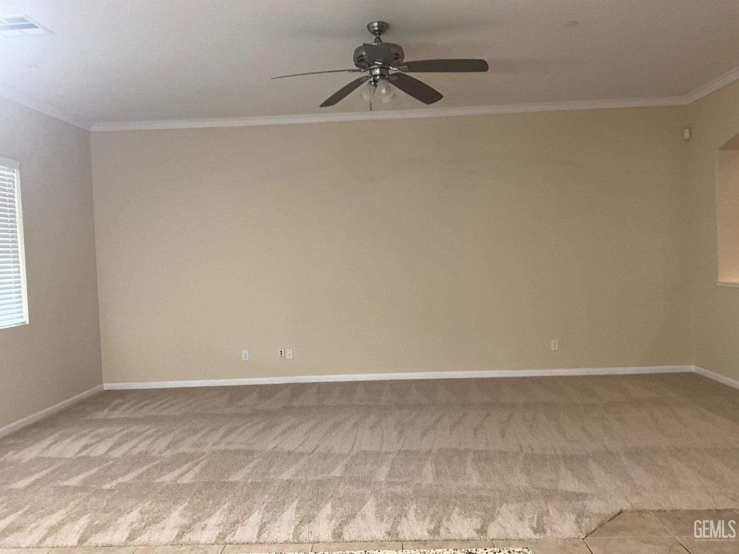 Undisclosed Address Bakersfield, CA 93314 - Photo 6 of 31 a view of a room with a ceiling fan and couch