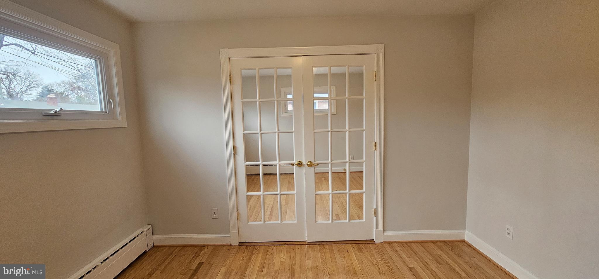 4202 Yates Road Beltsville, MD 20705 - Photo 15 of 35 a view of empty room with wooden floor and fan