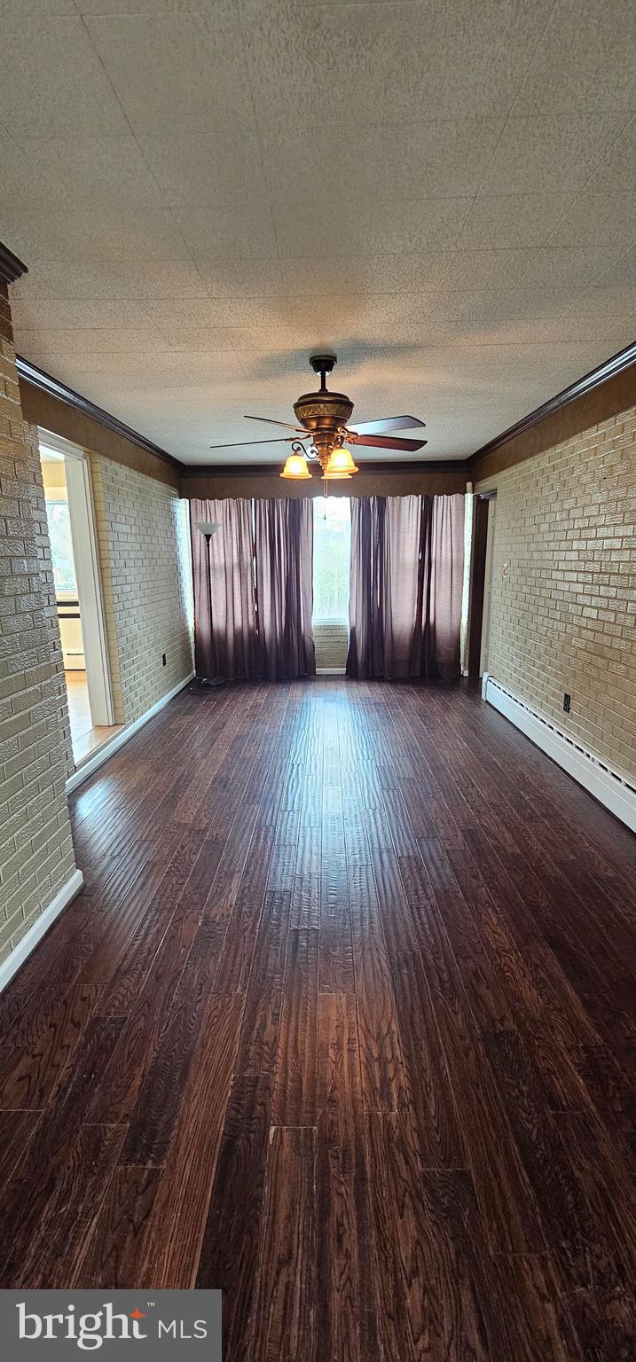 4202 Yates Road Beltsville, MD 20705 - Photo 16 of 35 wooden floor in an empty room with a window