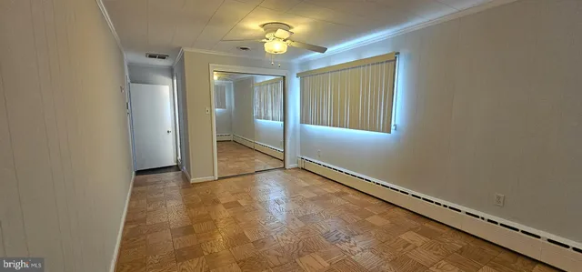 a view of an empty room with a window