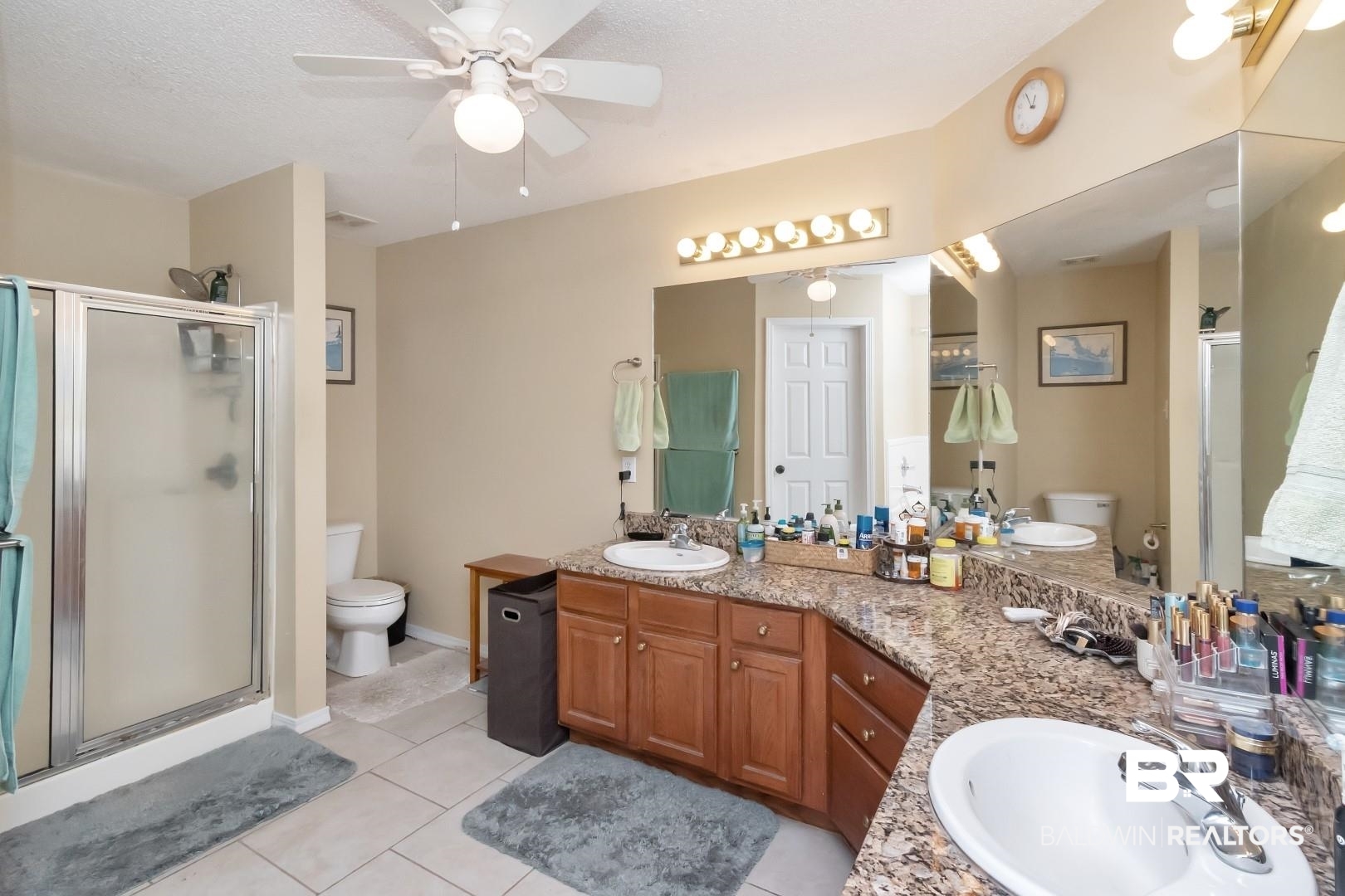 29221 Canterbury Road Daphne, AL 36526 - Photo 12 of 17 Bathroom with ceiling fan, tile patterned flooring, a shower with door, and toilet