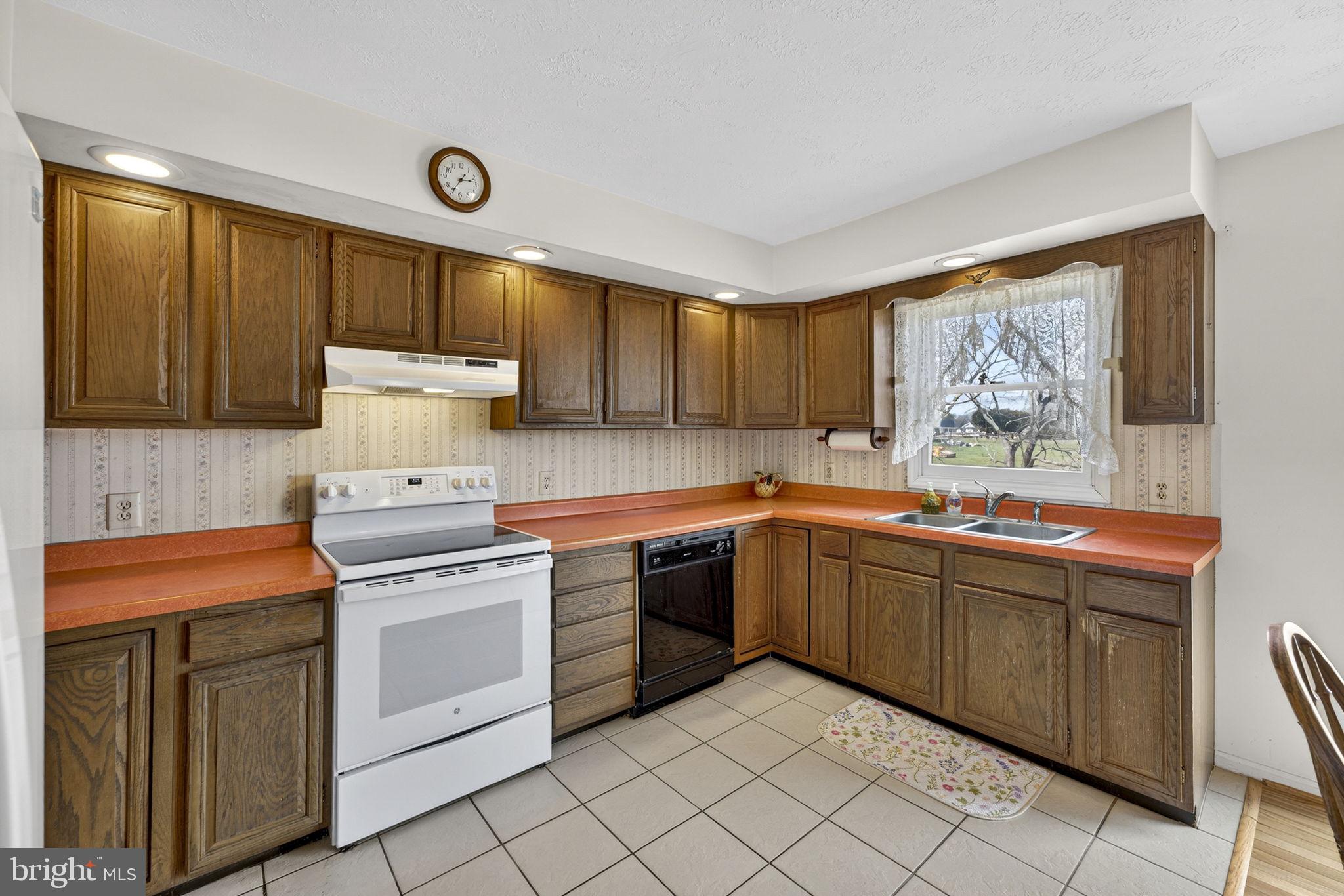 731 Kendrick Ford Road Front Royal, VA 22630 - Photo 11 of 85 a kitchen with a stove sink and cabinets