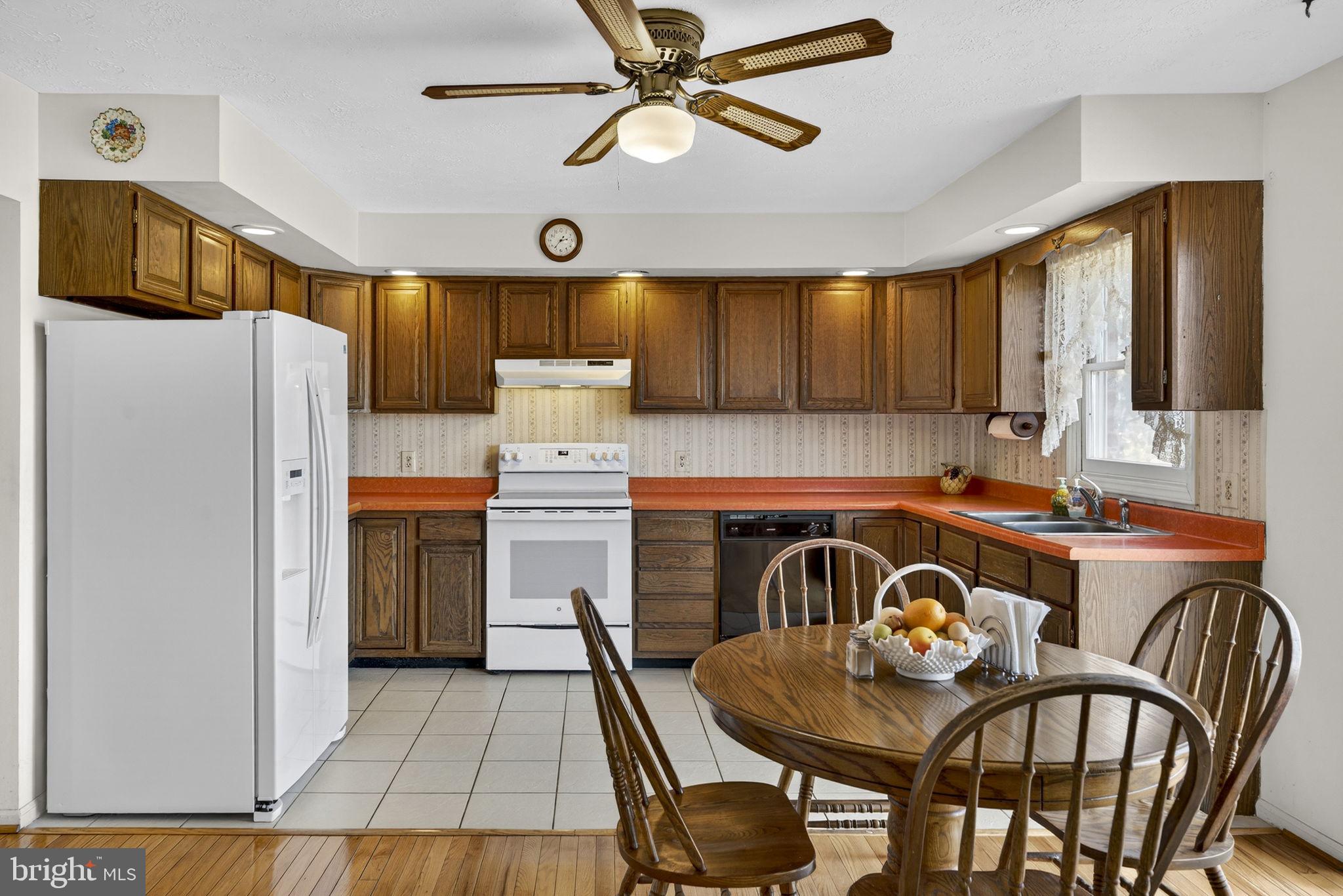 731 Kendrick Ford Road Front Royal, VA 22630 - Photo 15 of 85 a kitchen with stainless steel appliances granite countertop a stove a refrigerator a oven a sink with island and chairs