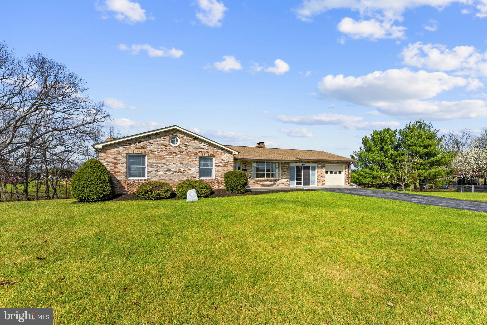 731 Kendrick Ford Road Front Royal, VA 22630 - Photo 3 of 85 a view of a big house with a big yard and large trees
