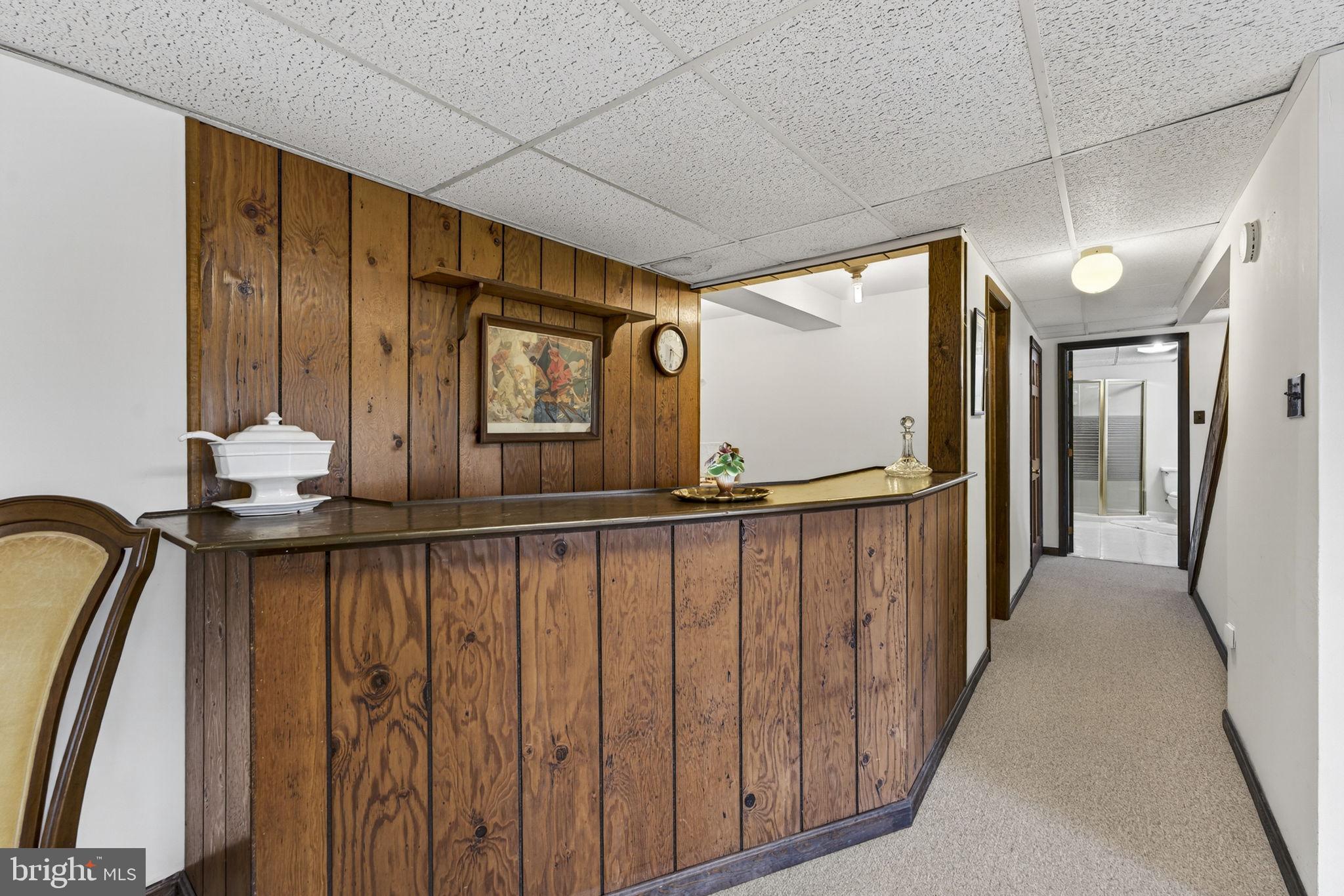 731 Kendrick Ford Road Front Royal, VA 22630 - Photo 38 of 85 a view of a hallway with wooden floor and chair