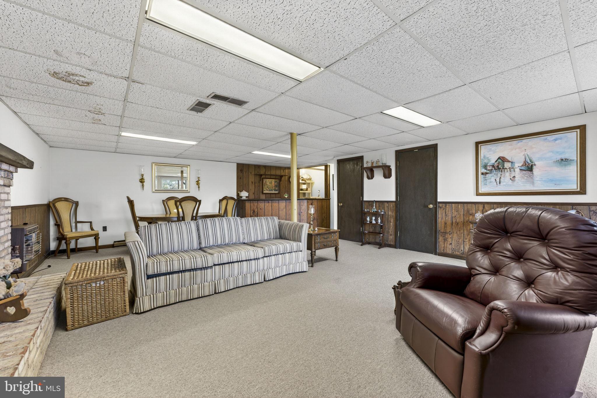 731 Kendrick Ford Road Front Royal, VA 22630 - Photo 42 of 85 a living room with furniture ceiling fan and a rug