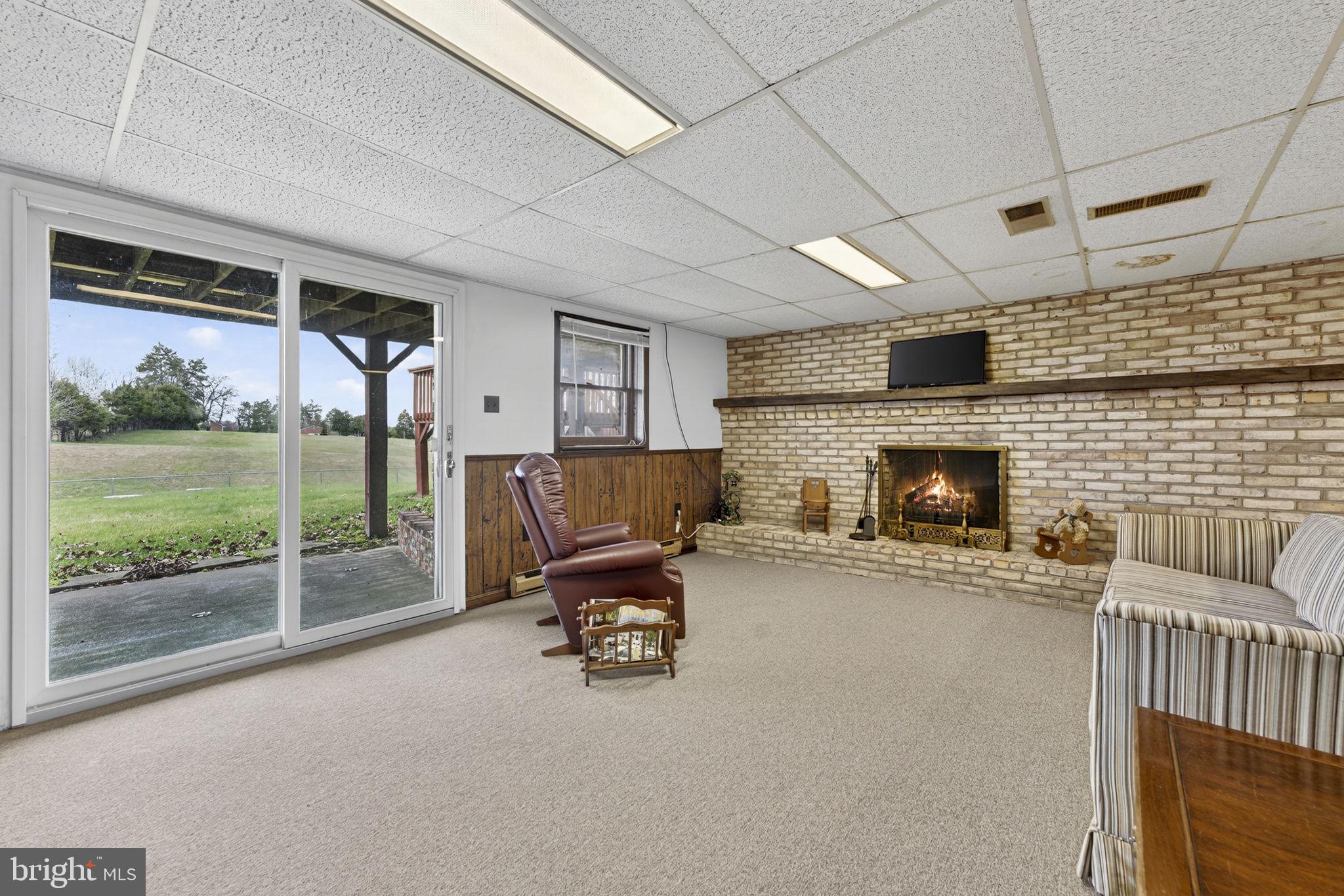 731 Kendrick Ford Road Front Royal, VA 22630 - Photo 43 of 85 a living room with furniture and a fireplace