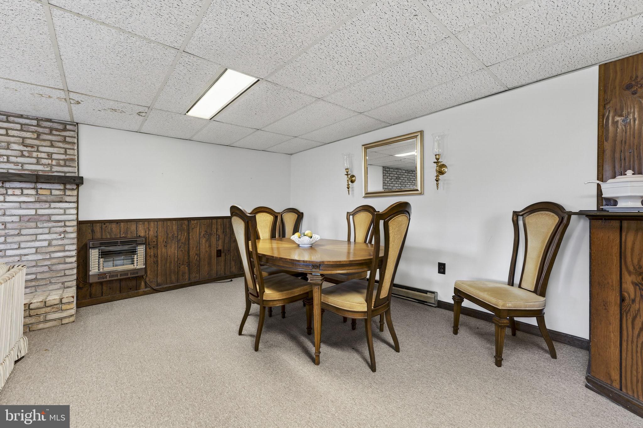 731 Kendrick Ford Road Front Royal, VA 22630 - Photo 44 of 85 a view of a dining room with furniture and a fireplace