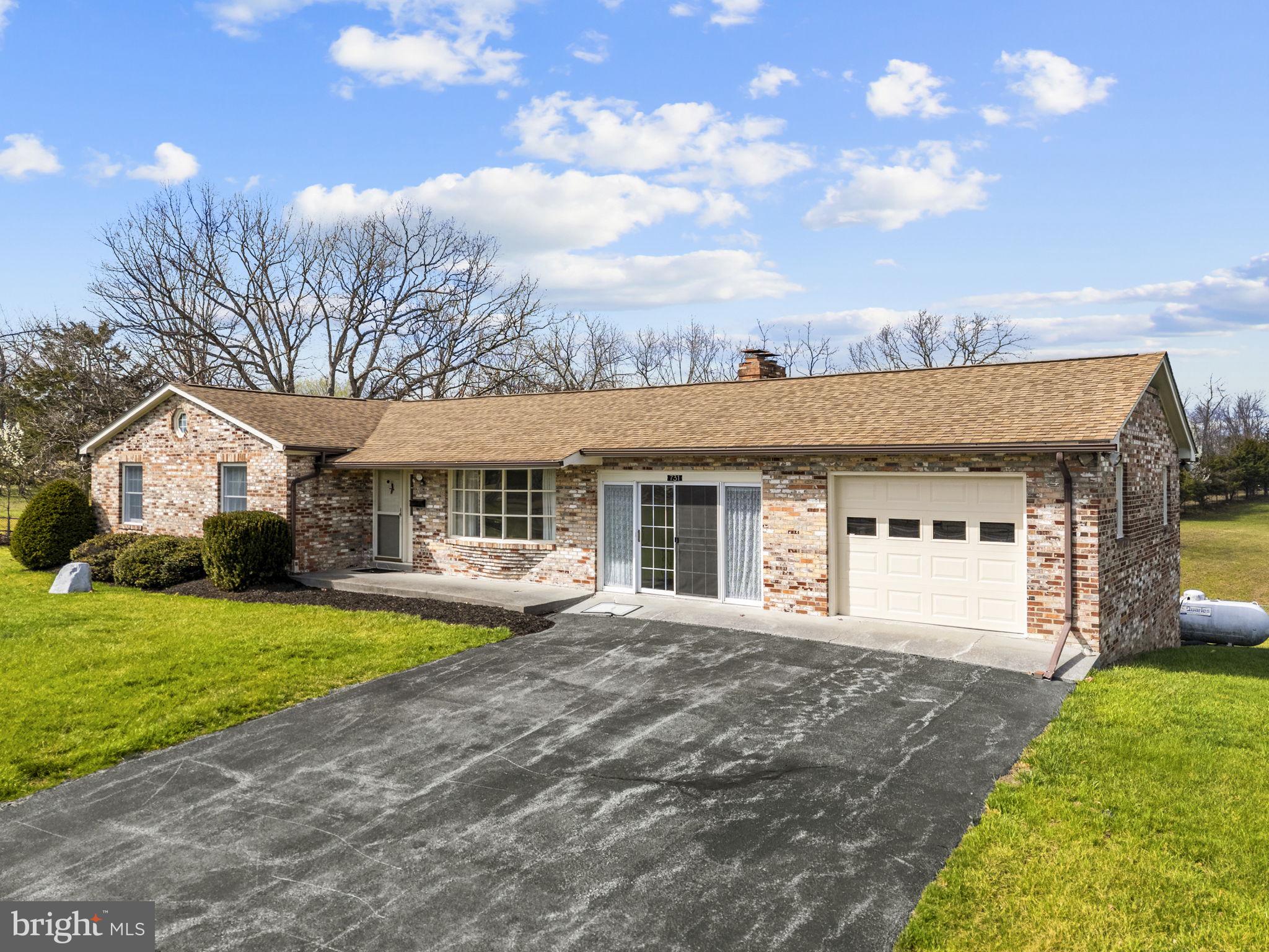 731 Kendrick Ford Road Front Royal, VA 22630 - Photo 5 of 85 a front view of a house with a yard and garage