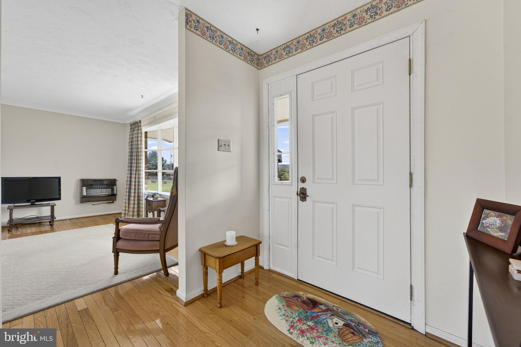 731 Kendrick Ford Road Front Royal, VA 22630 - Photo 6 of 85 a living room with furniture and a wooden floor