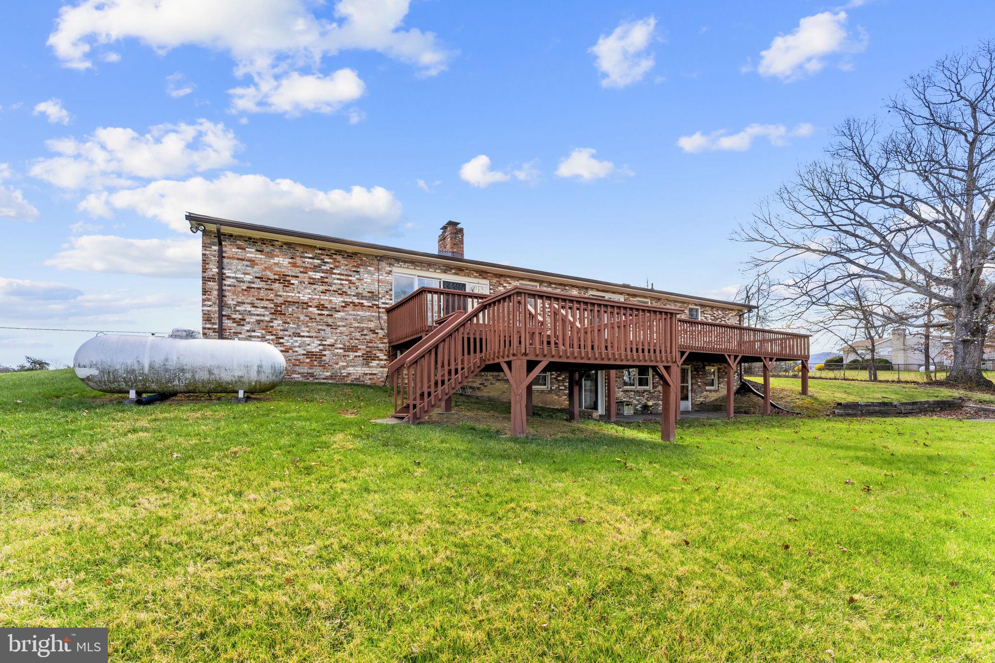 731 Kendrick Ford Road Front Royal, VA 22630 - Photo 64 of 85 a view of a house with a big yard and large tree