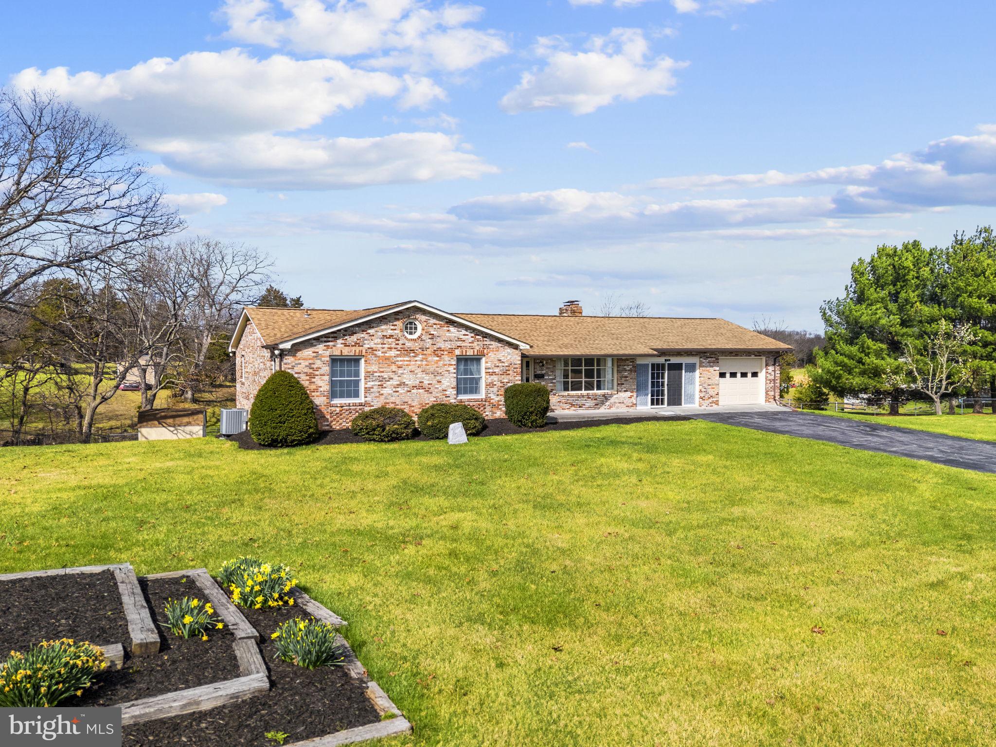 731 Kendrick Ford Road Front Royal, VA 22630 - Photo 75 of 85 a front view of a house with garden