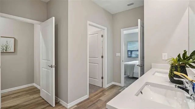 a room with a bed and a hallway