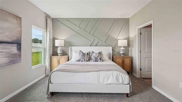 a bedroom with a bed and window