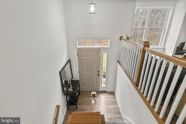 a view of a bedroom with furniture and windows