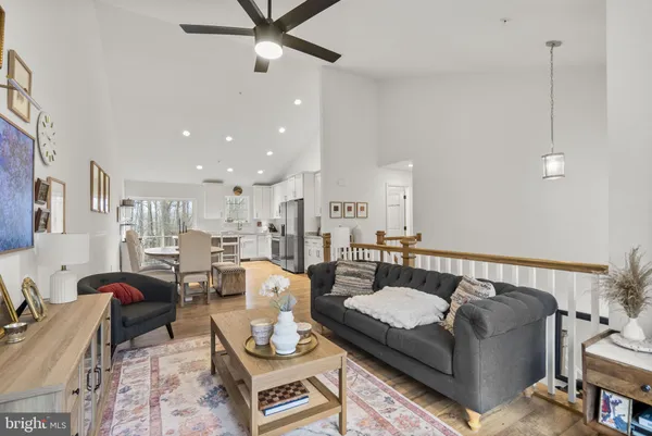 a bedroom with furniture and a flat screen tv