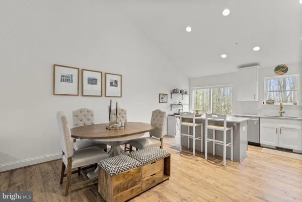 a living room with furniture and a mirror
