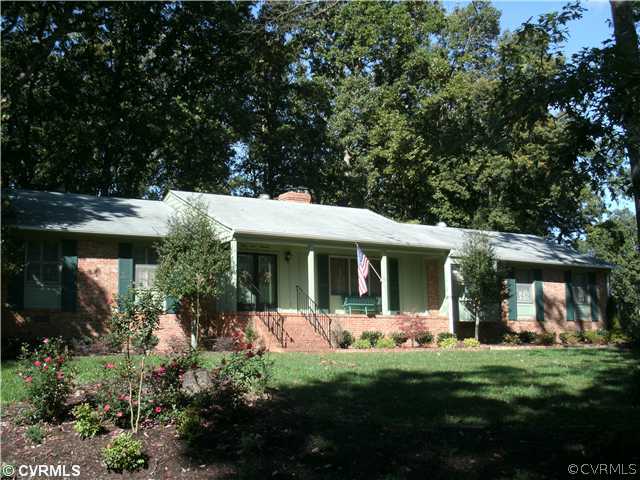 4100 Cresthill Road Chester, VA 23831 - Photo 1 of 7 a view of a house with backyard porch and garden