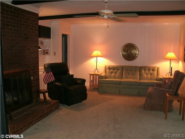 4100 Cresthill Road Chester, VA 23831 - Photo 4 of 7 a living room with furniture and a fireplace