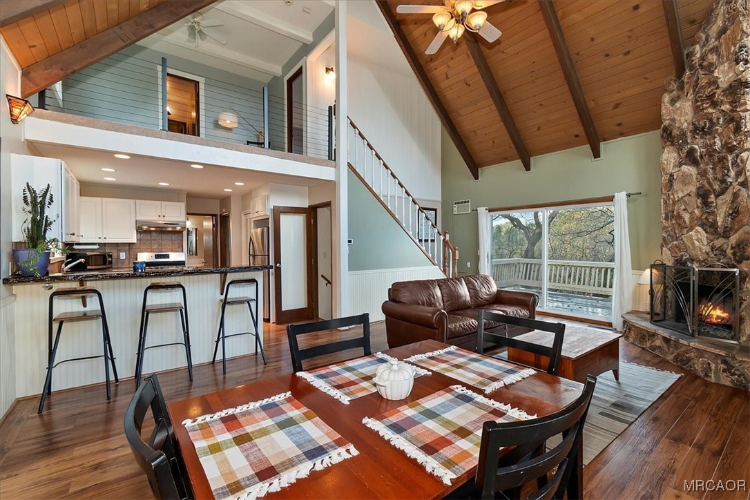 26822 Huron Road Lake Arrowhead, CA 92391 - Photo 12 of 38 a living room with furniture and a floor to ceiling window