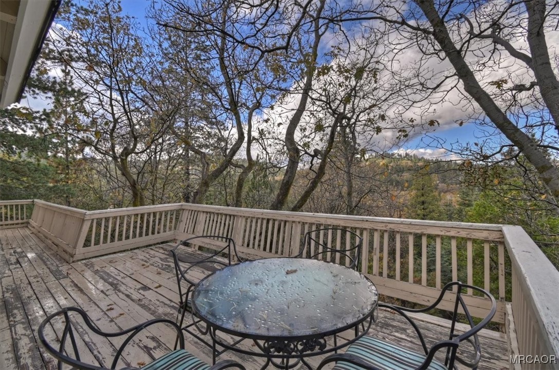 26822 Huron Road Lake Arrowhead, CA 92391 - Photo 21 of 38 a view of a chair and table in the balcony