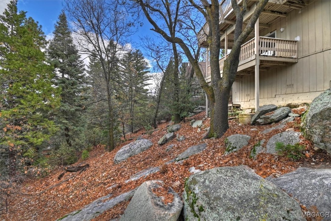 26822 Huron Road Lake Arrowhead, CA 92391 - Photo 22 of 38 a backyard of a house with large trees