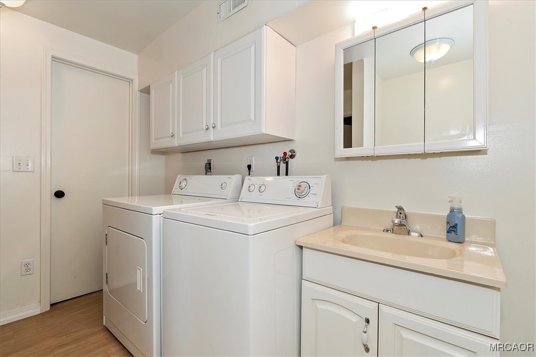 26822 Huron Road Lake Arrowhead, CA 92391 - Photo 26 of 38 a utility room with sink dryer and washer