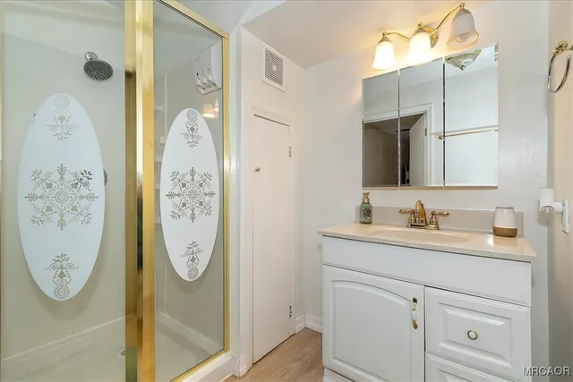 a bathroom with a mirror and a sink