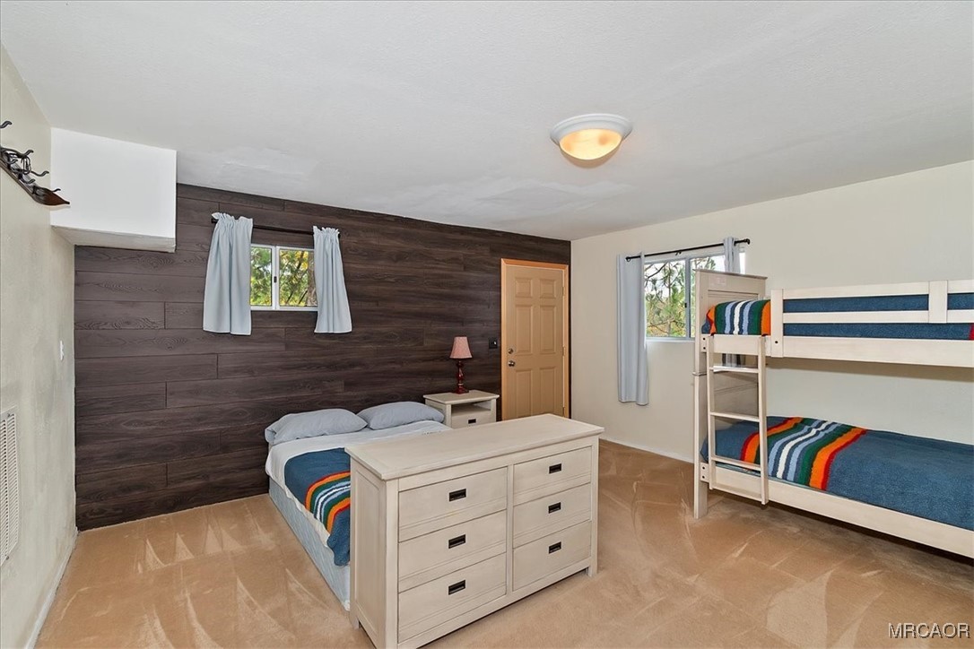 26822 Huron Road Lake Arrowhead, CA 92391 - Photo 38 of 38 a bed room with a bed and a chair