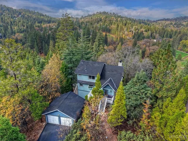 an aerial view of houses with yard