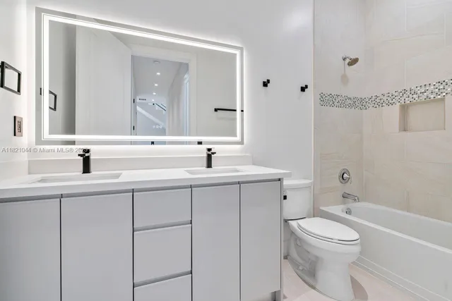 an aerial view of residential house with outdoor space and parking