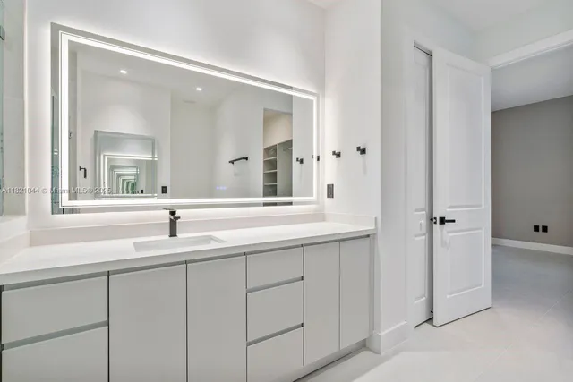 a patio with couches and a fire pit