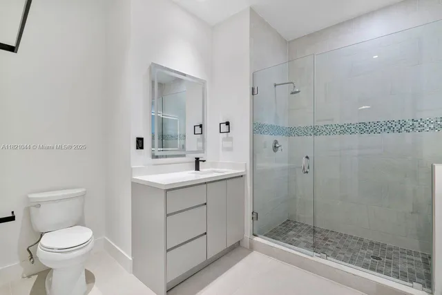 a view of backyard with tub and door