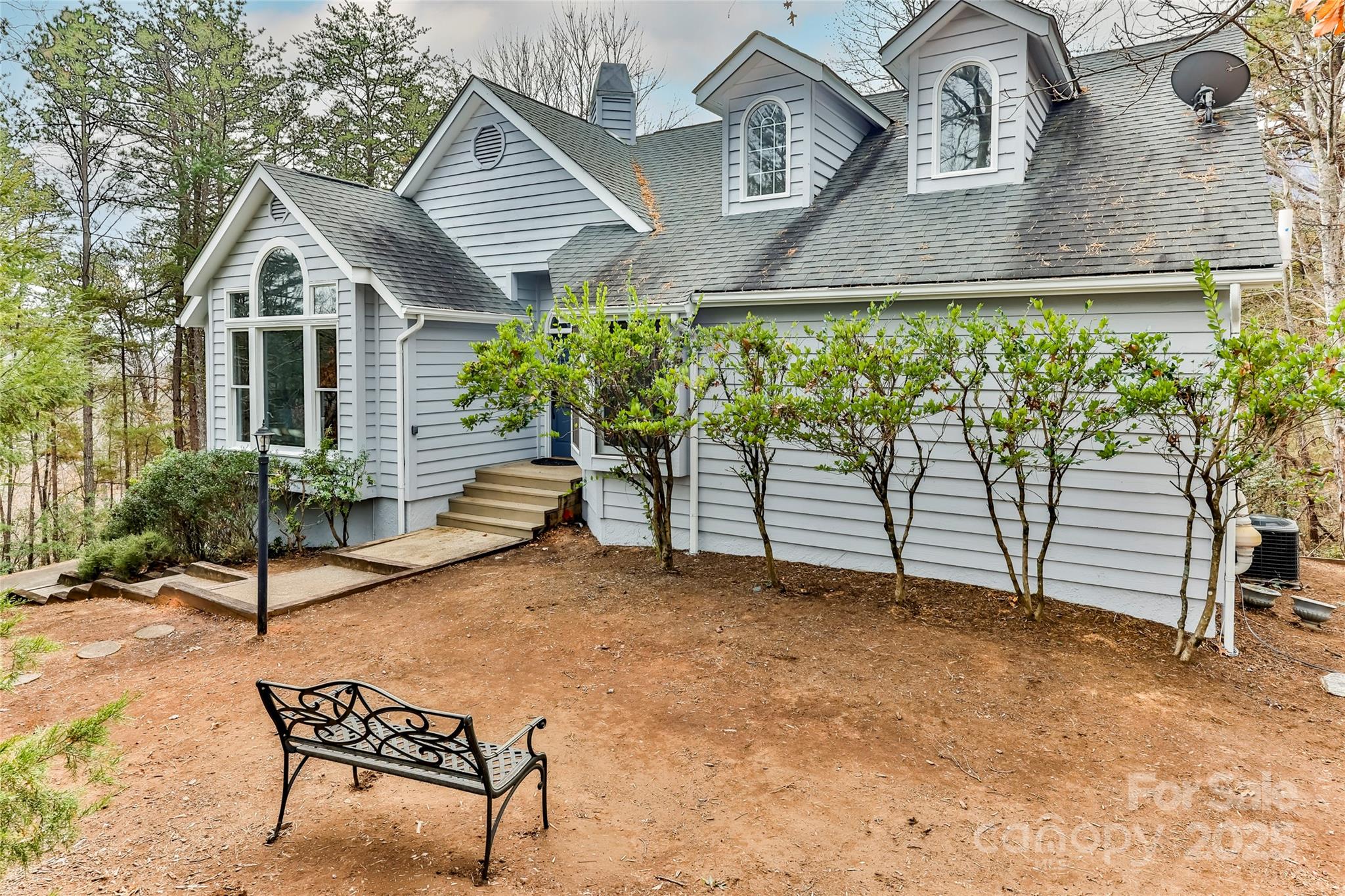 a view of a house with backyard porch and sitting area