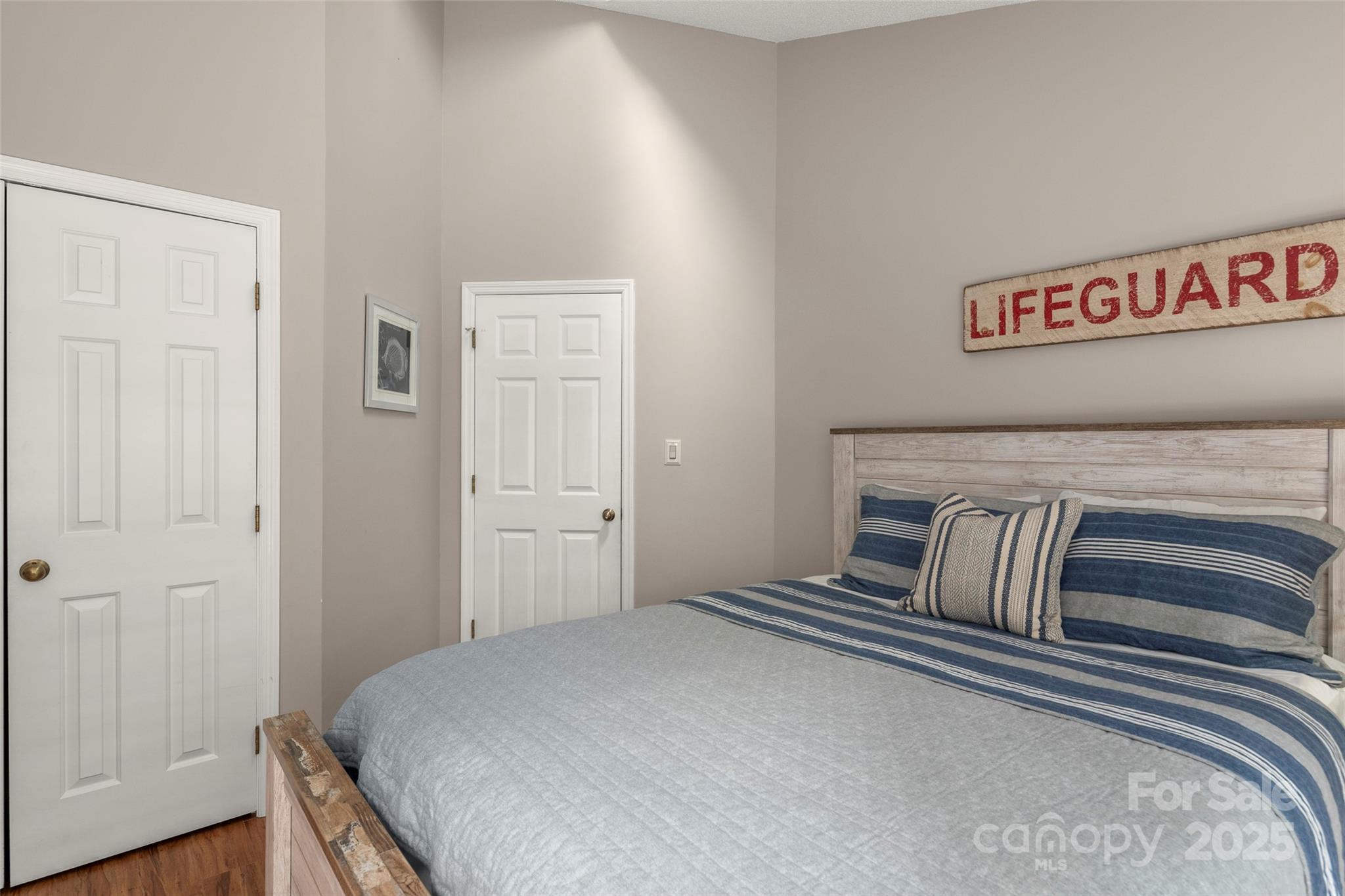 212 Ridgeway Road Lake Lure, NC 28746 - Photo 21 of 44 a bedroom with a bed and a dresser