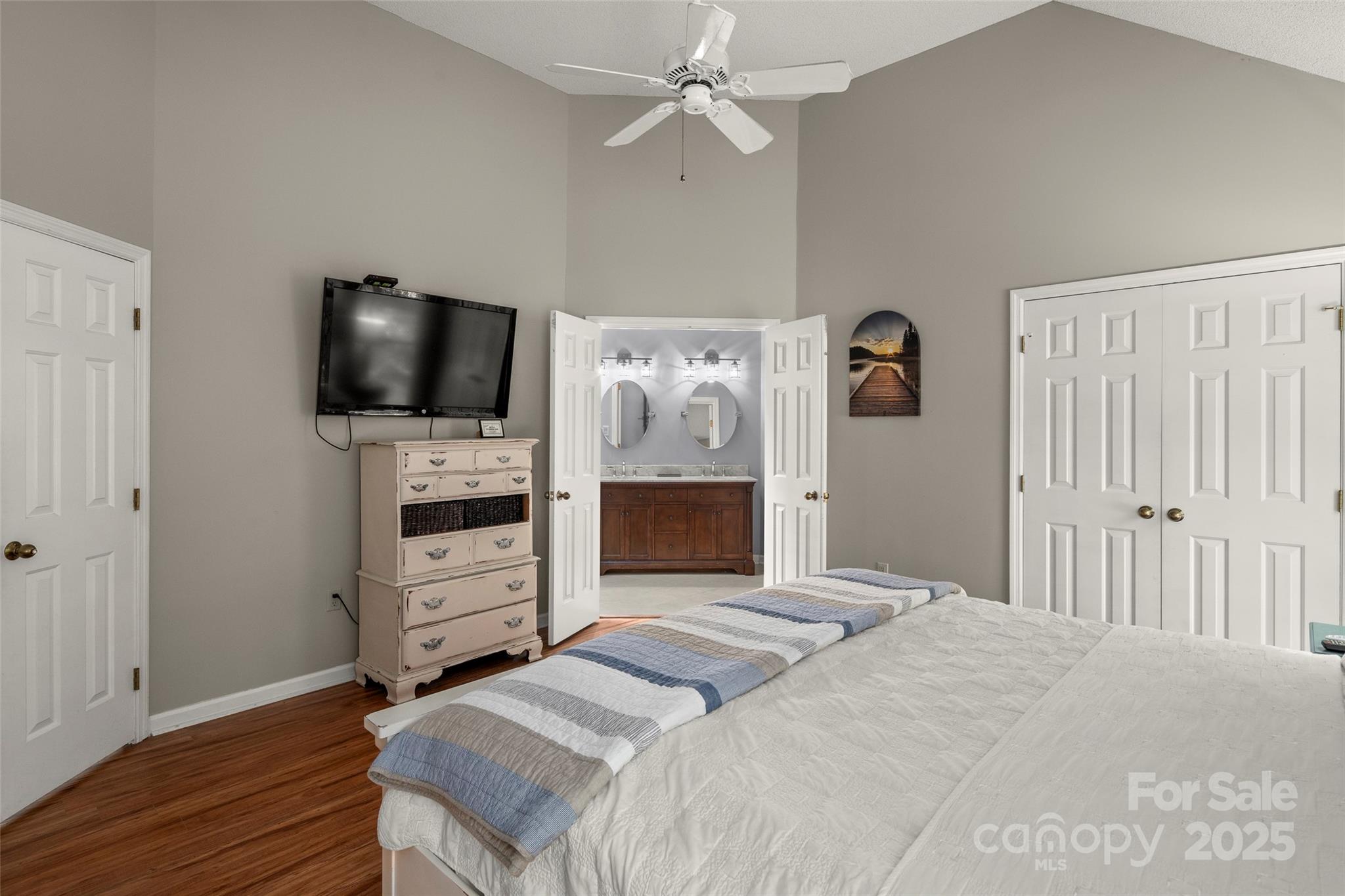 212 Ridgeway Road Lake Lure, NC 28746 - Photo 23 of 44 a bedroom with a bed and a flat screen tv