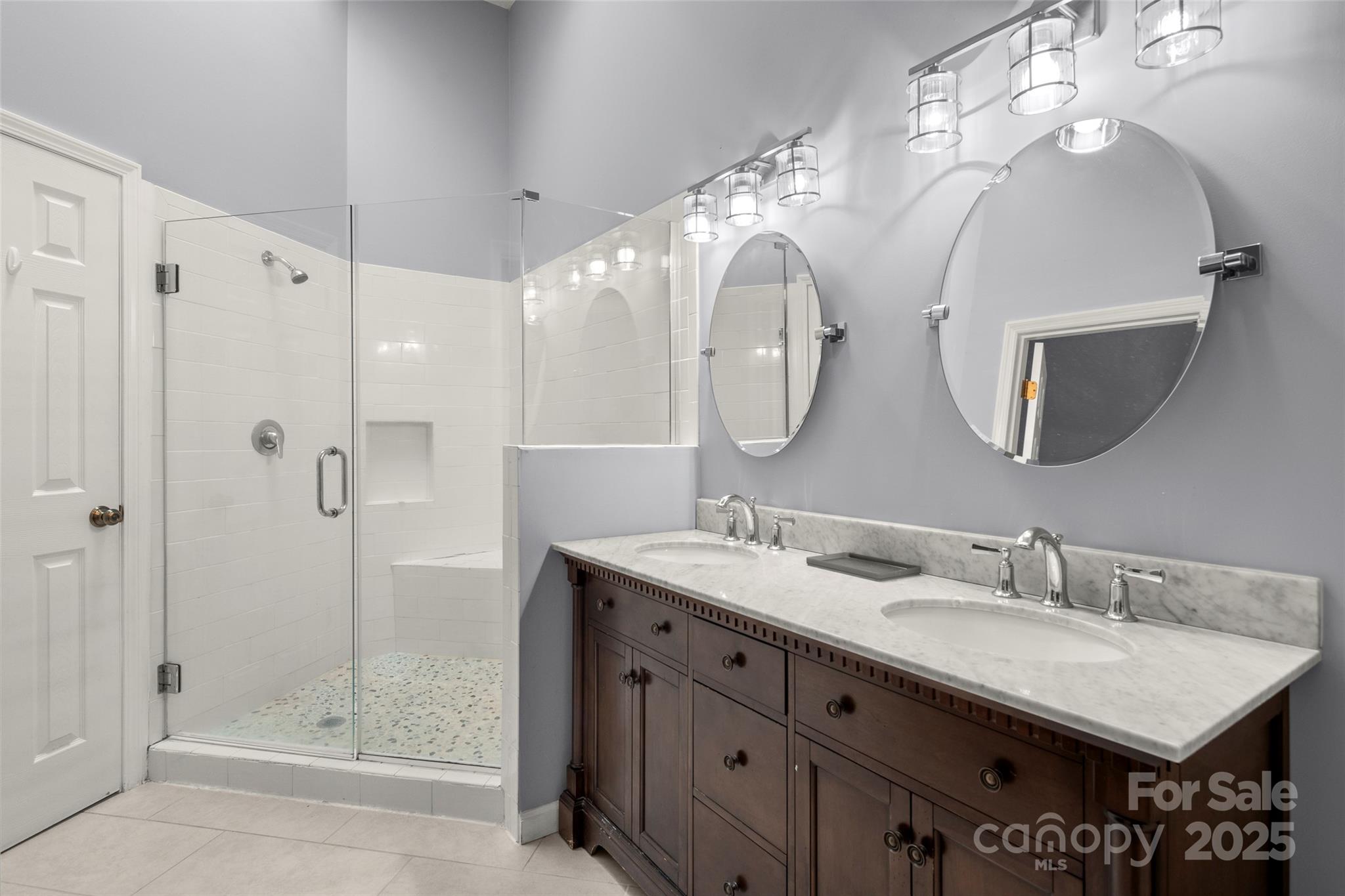 212 Ridgeway Road Lake Lure, NC 28746 - Photo 24 of 44 a bathroom with a double vanity sink mirror and shower
