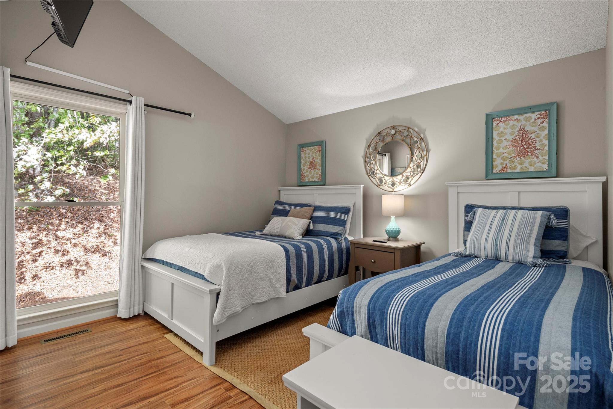 212 Ridgeway Road Lake Lure, NC 28746 - Photo 25 of 44 a bedroom with two beds and wooden floor
