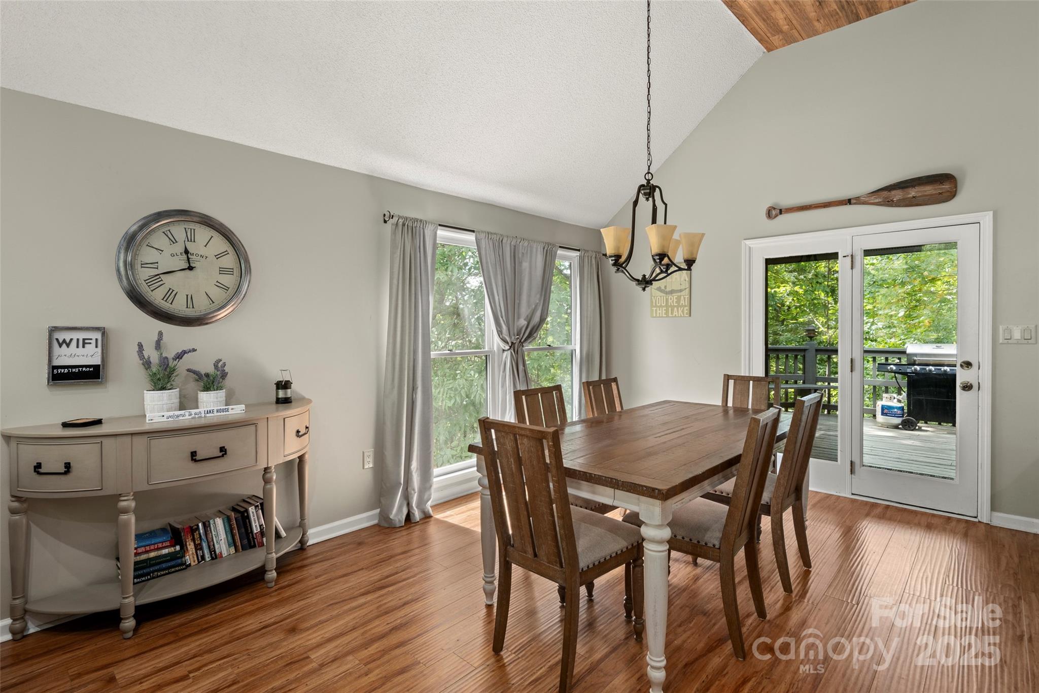 212 Ridgeway Road Lake Lure, NC 28746 - Photo 26 of 44 a view of a dining room with furniture window and wooden floor