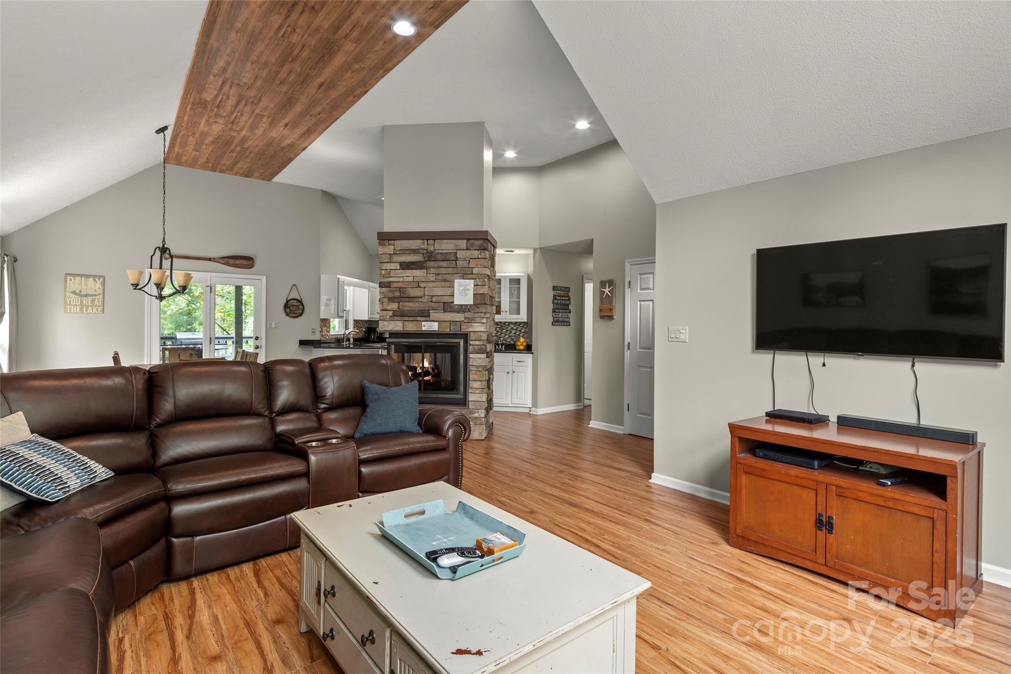 212 Ridgeway Road Lake Lure, NC 28746 - Photo 27 of 44 a living room with furniture and a flat screen tv