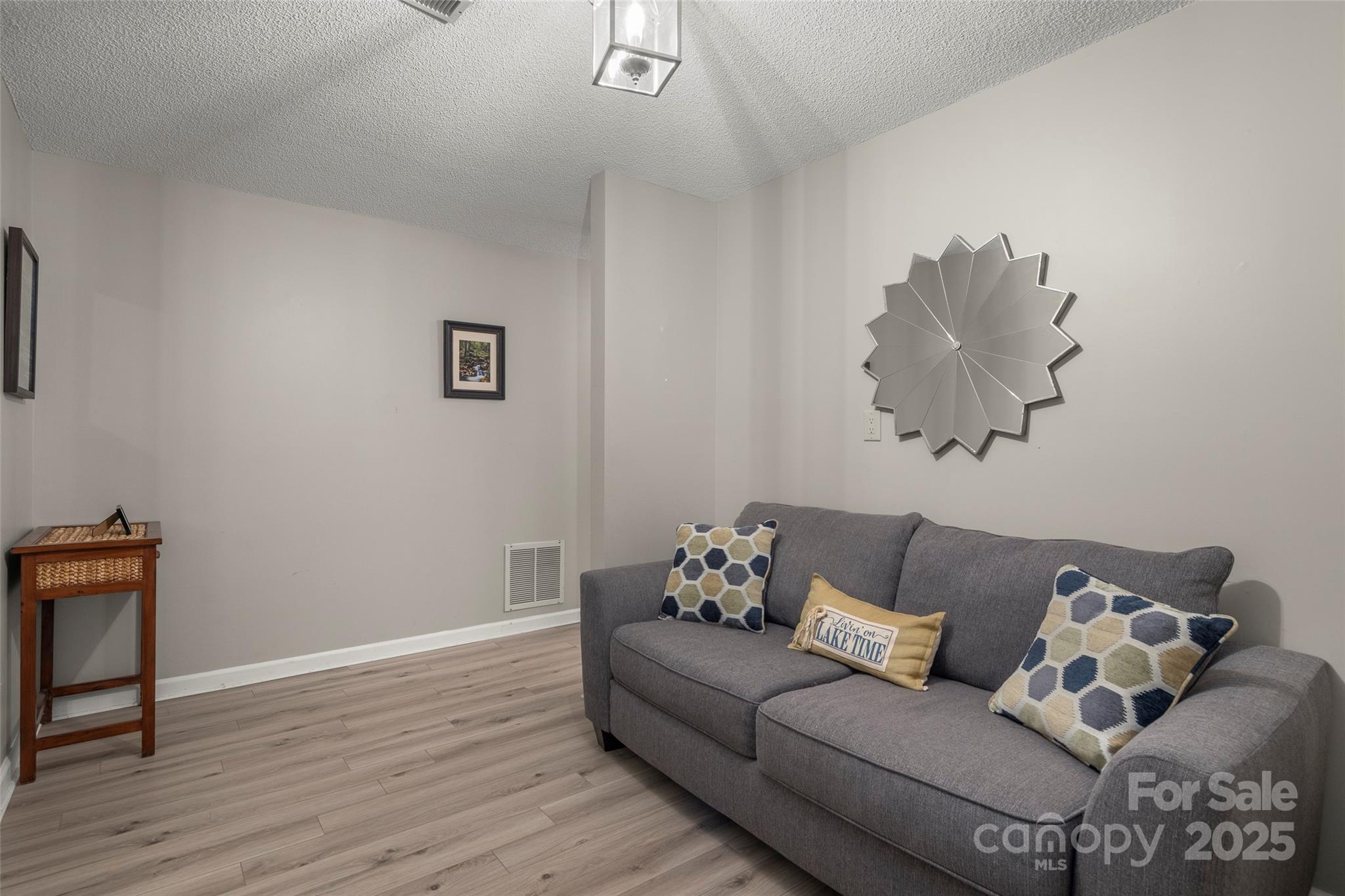 212 Ridgeway Road Lake Lure, NC 28746 - Photo 29 of 44 a living room with furniture and wooden floor