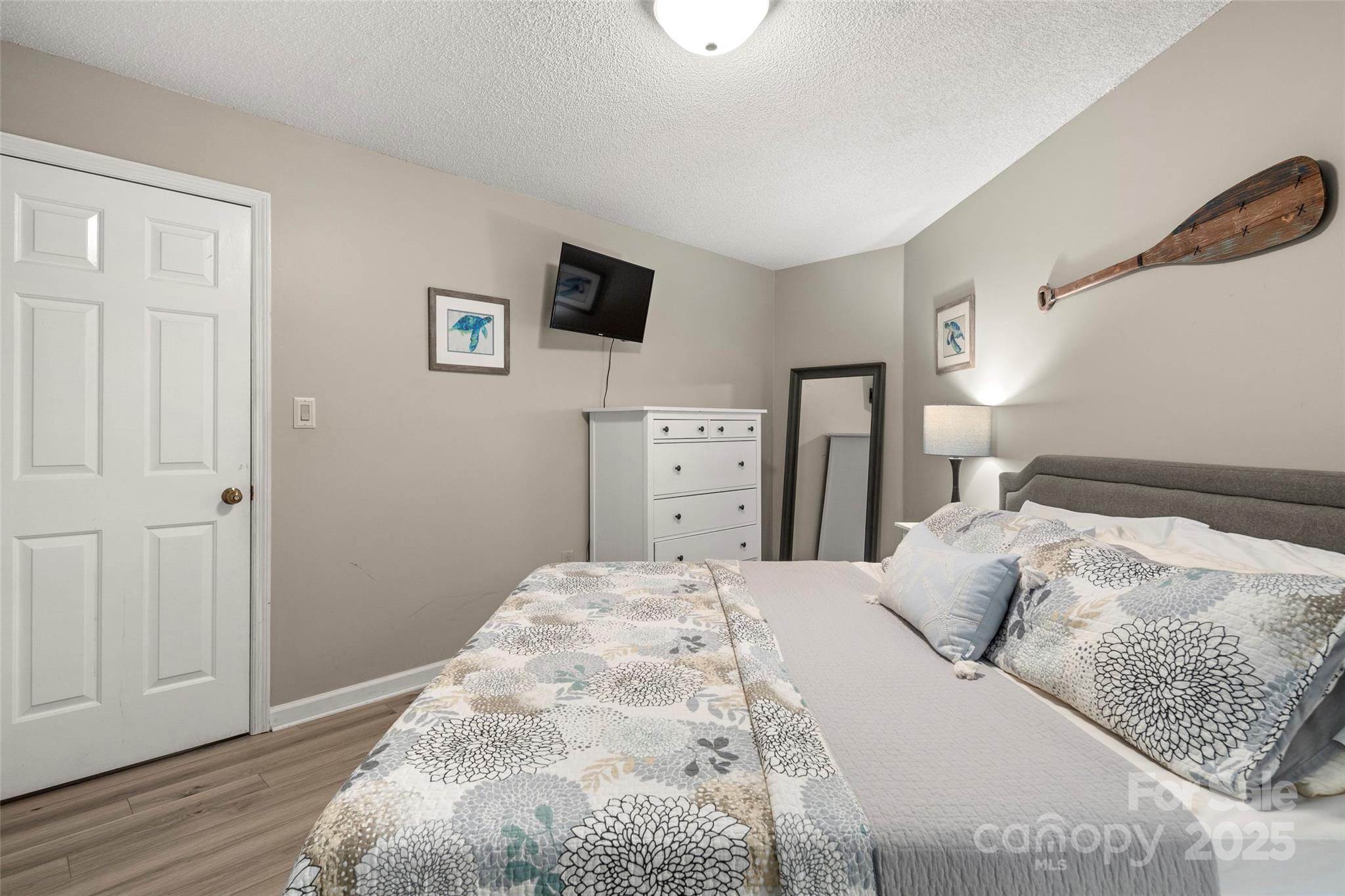 212 Ridgeway Road Lake Lure, NC 28746 - Photo 32 of 44 a bedroom with a bed and a tv