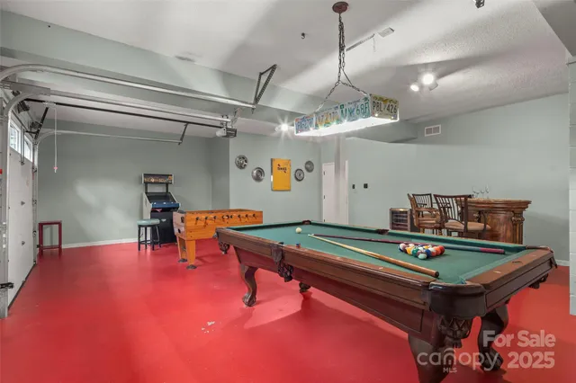 a room with furniture and pool table
