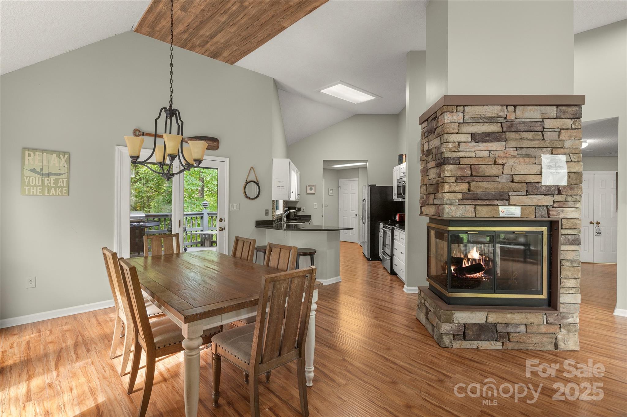 212 Ridgeway Road Lake Lure, NC 28746 - Photo 39 of 44 a view of a dining room with furniture window and wooden floor