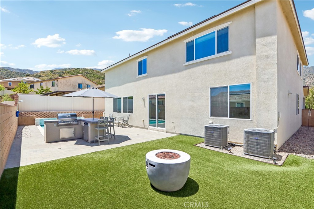 11056 Guffey Ranch Way Corona, CA 92883 - Photo 44 of 61 a view of a house with a back yard