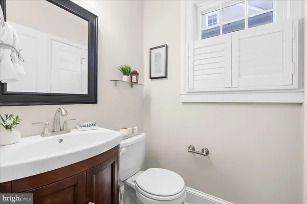 a spacious bedroom with a bed and a table in it
