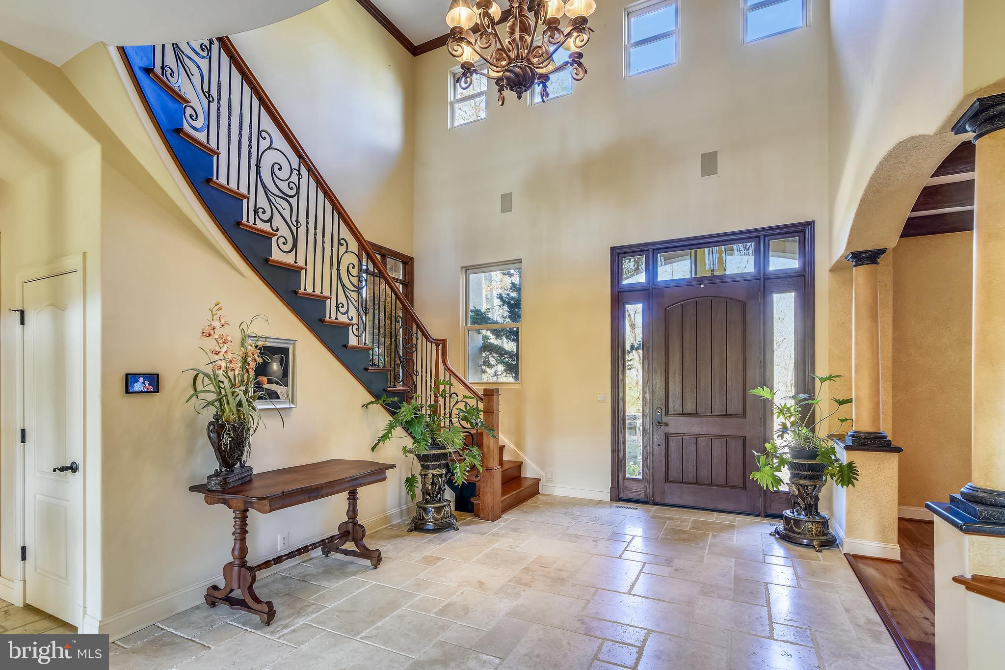 38283 Hughesville Road Leesburg, VA 20175 - Photo 4 of 77 Travertine marble & a curved cherry staircase.