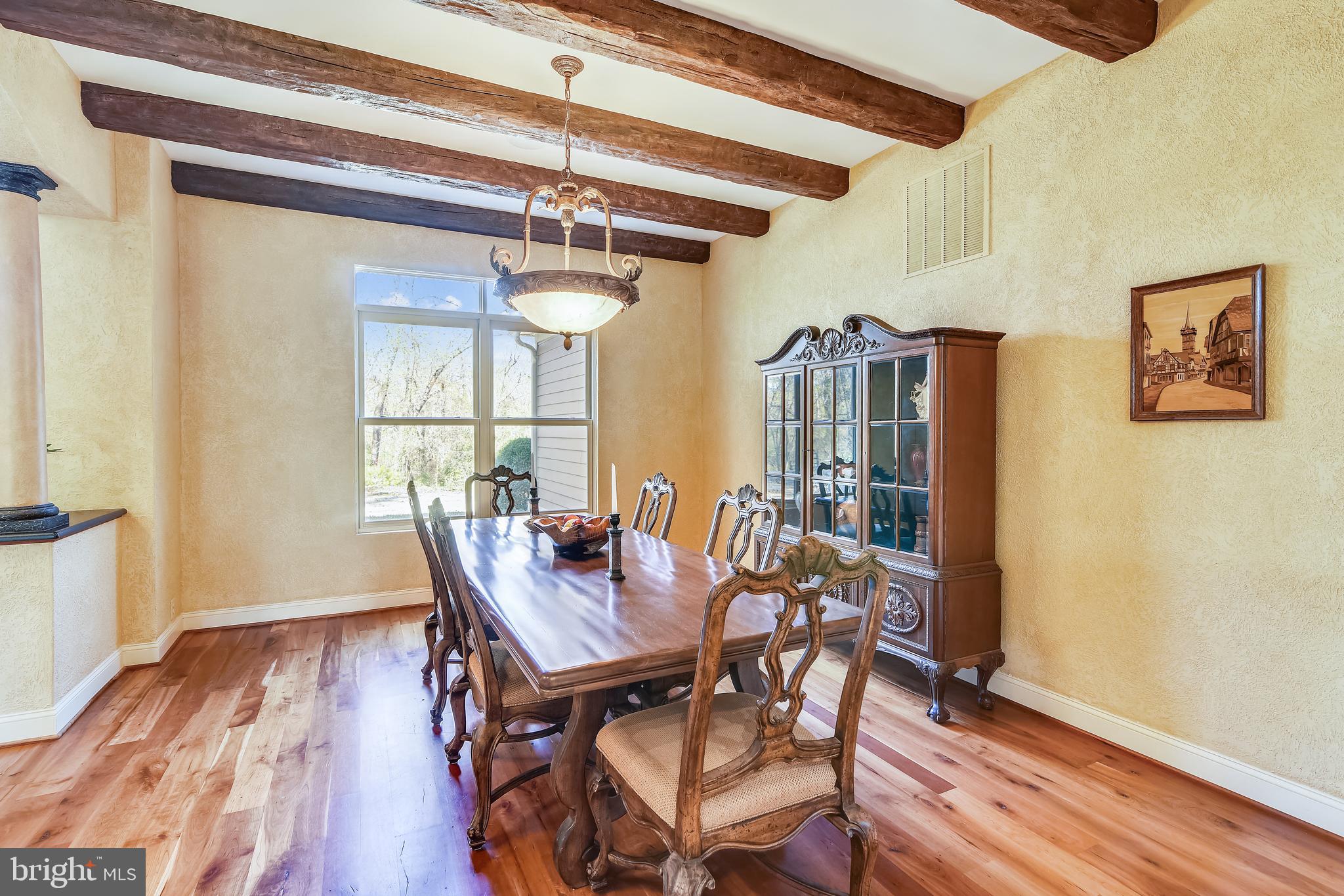 38283 Hughesville Road Leesburg, VA 20175 - Photo 7 of 77 Formal dining room finished with rustic wood beams