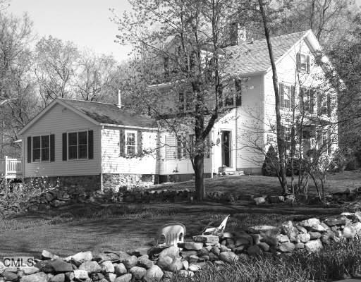49 Nod Hill Road Ridgefield, CT 06877 - Photo 1 of 1 a front view of a house with a yard